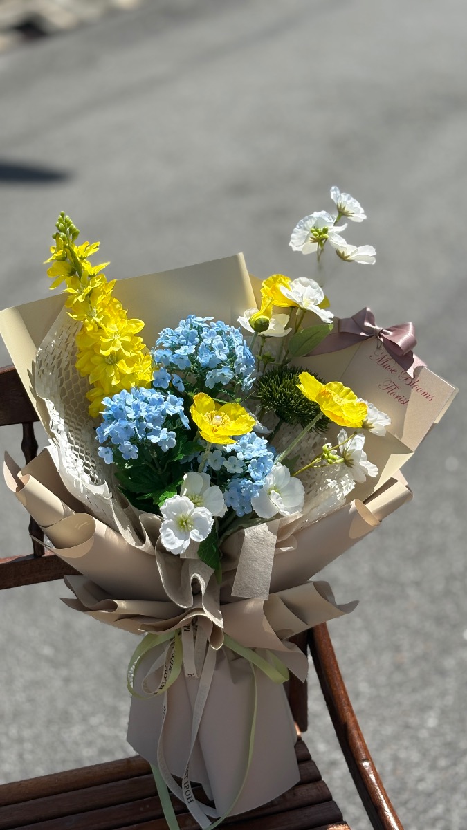 Blue & yellow artificial flower bouquet
