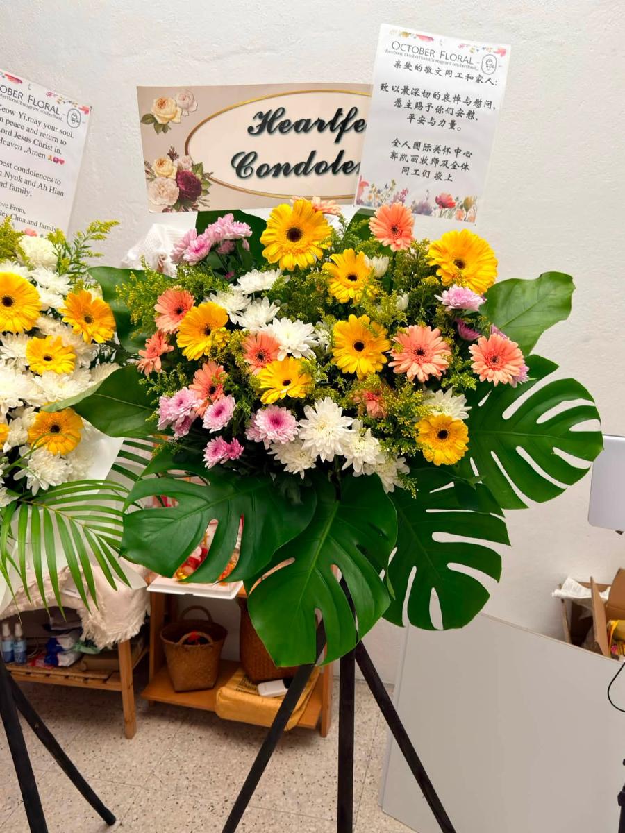 Warm Embrace - Mixed Gerbera & Monstera Sympathy Stand