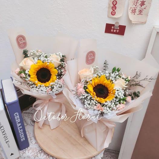 Light Pink Wrapped Bouquet with Twin Sunflowers, Soft Roses, and Baby's Breath