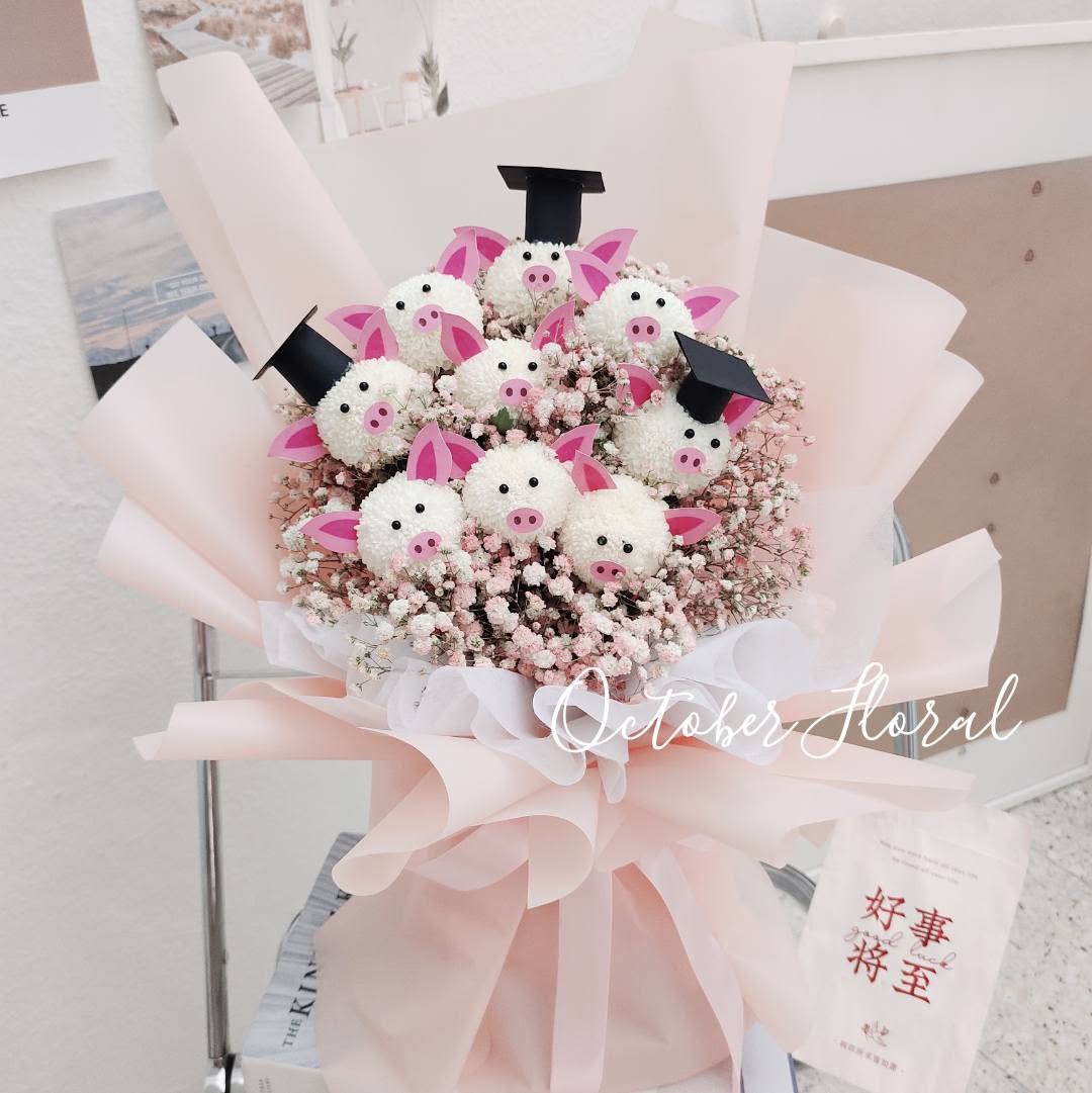 Pink Multi-Layer Wrapped Bouquet with Cute Plush Piglets Wearing Graduation Caps and Baby's Breath