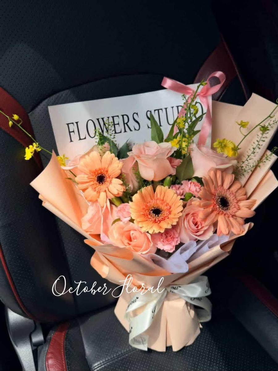 Soft Pink Warmth - Hand-Tied Bouquet in Light Pink Wrapping with Pink Roses, Gerberas, and Fresh Greenery