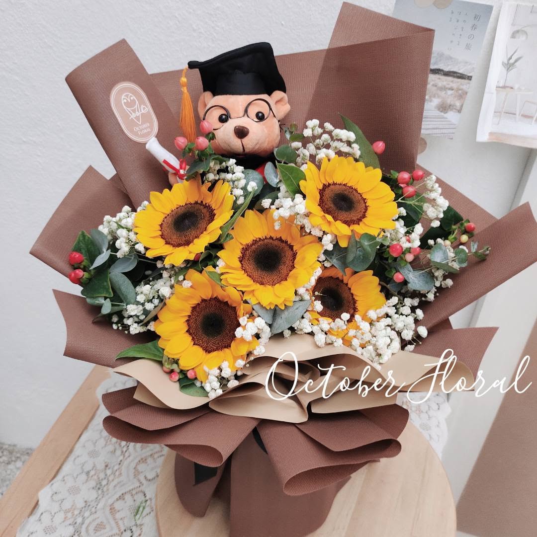Sunny Graduate Bear - Dark Brown Multi-Layer Wrapped Bouquet with Multiple Sunflowers, Baby's Breath, and a Bear Wearing a Graduation Cap