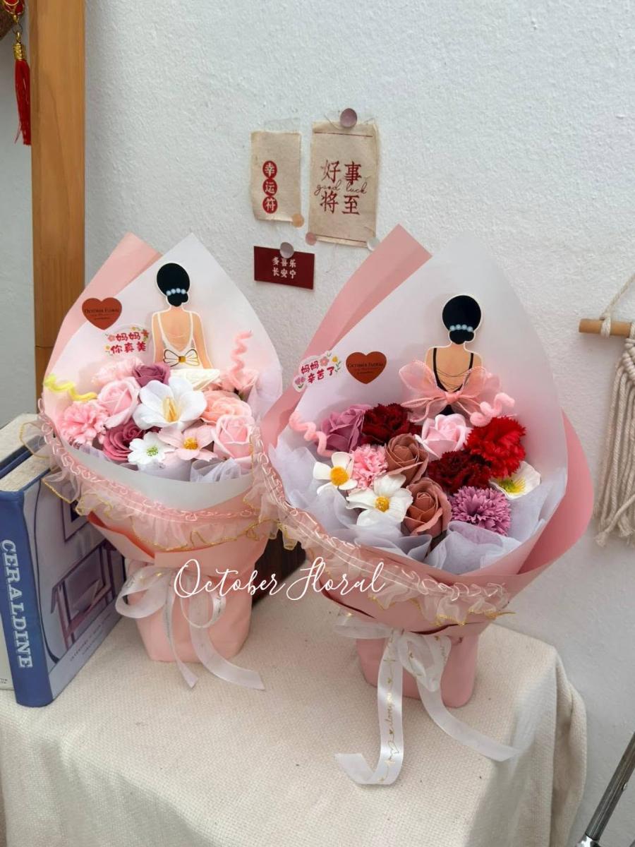 Warm Bouquets in Pink Packaging Featuring Elegant Dolls