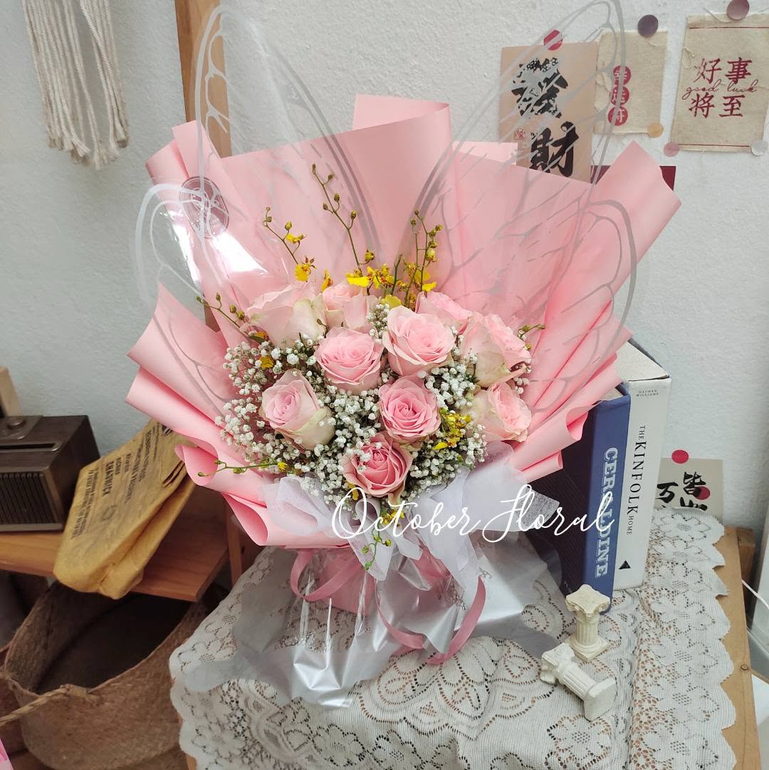 Pink Dream - Hand-Tied Pink Rose Bouquet in Light Pink Multi-Layer Packaging, Adorned with Transparent Angel Wings, Yellow Oncidiums, and Baby's Breath