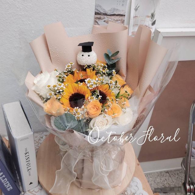 Milkyway Graduate - Sunflower & Rose Snowman Bouquet in Latte Wrap